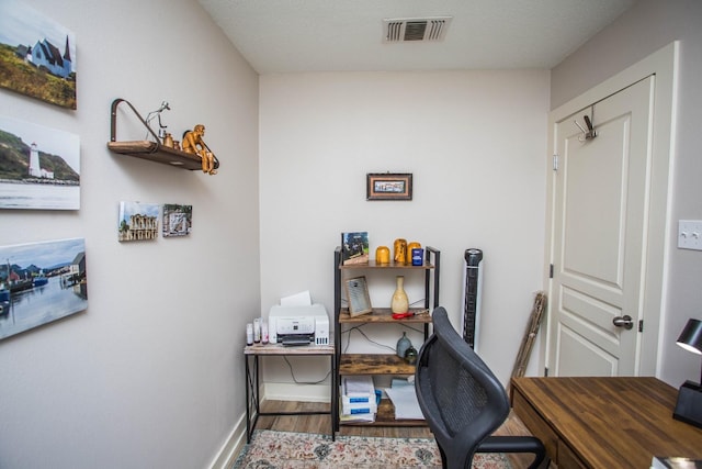 office space with hardwood / wood-style flooring