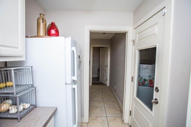 corridor featuring light tile patterned floors