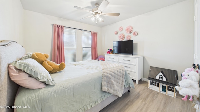 1105 Cajun St, Odessa, TX 79765 - bedroom with light wood finished floors and ceiling fan