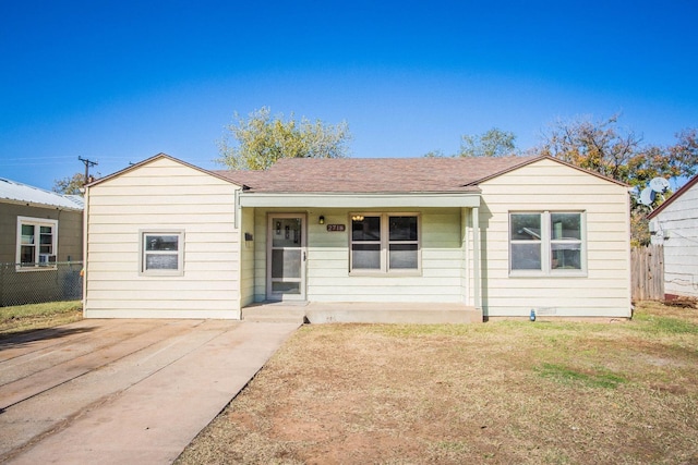 ranch-style house with a front lawn