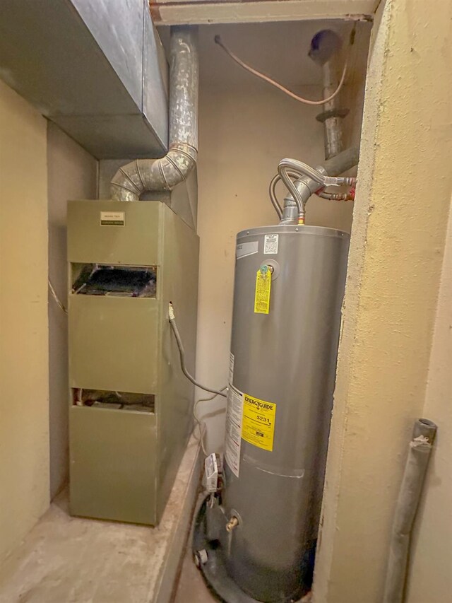 utility room featuring gas water heater