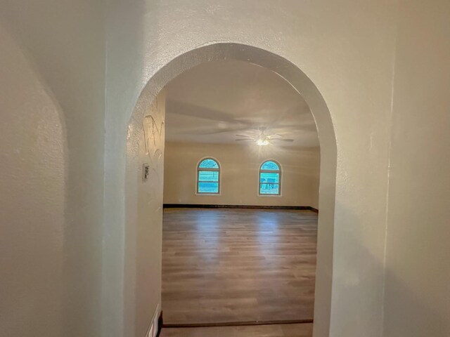 spare room with ceiling fan and hardwood / wood-style floors