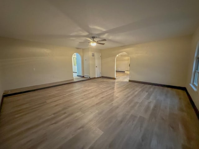 spare room featuring hardwood / wood-style floors and ceiling fan