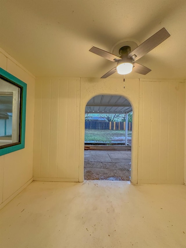 interior space with concrete floors and ceiling fan