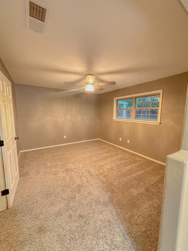 unfurnished room with carpet floors and ceiling fan