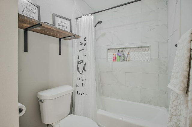 bathroom with shower / tub combo and toilet