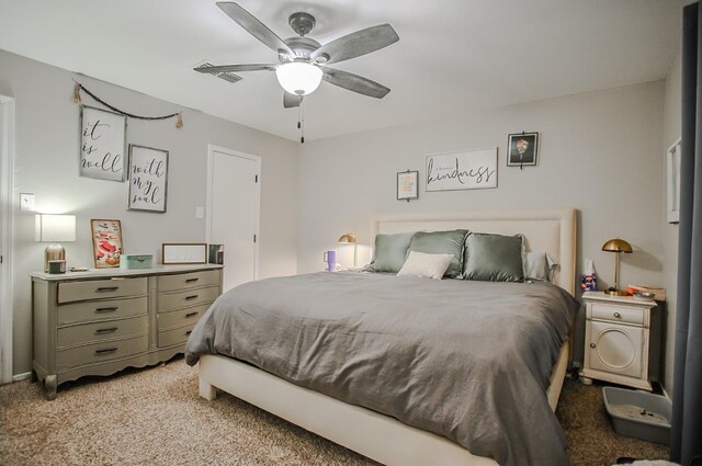 bedroom featuring light colored carpet and ceiling fan