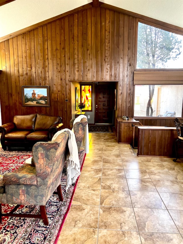 tiled living room with wooden walls and high vaulted ceiling