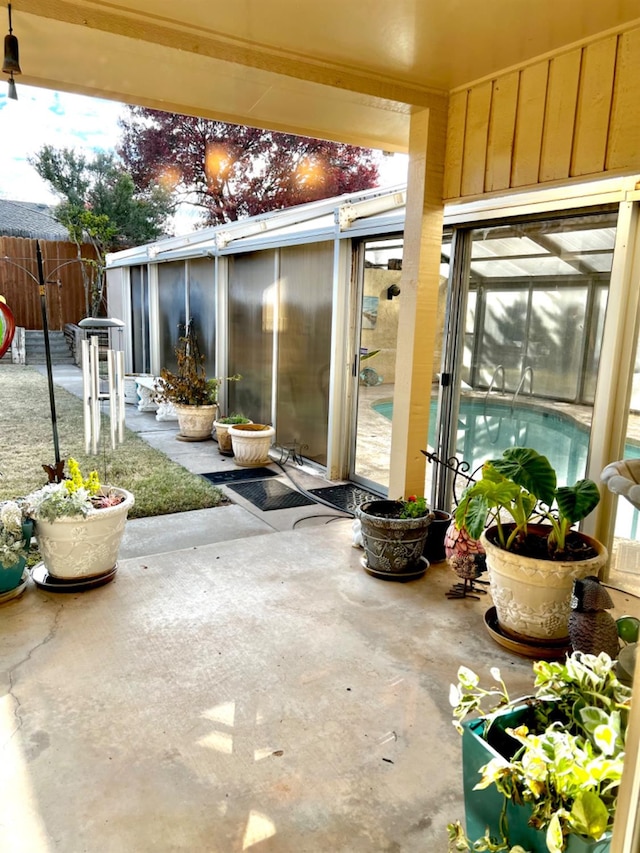 view of patio with a sunroom