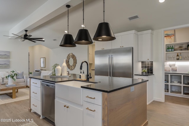 3617 127th St, Lubbock, TX 79423 - kitchen featuring stainless steel appliances, light wood-style flooring, dark countertops, and recessed lighting