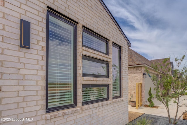 3617 127th St, Lubbock, TX 79423 - view of side of property with brick siding and roof with shingles