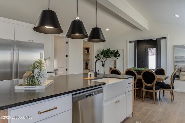 3617 127th St, Lubbock, TX 79423 - kitchen featuring appliances with stainless steel finishes, white cabinets, light wood-type flooring, hanging light fixtures, and recessed lighting