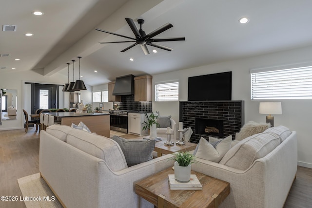3617 127th St, Lubbock, TX 79423 - living area with a ceiling fan, a brick fireplace, light wood finished floors, and recessed lighting