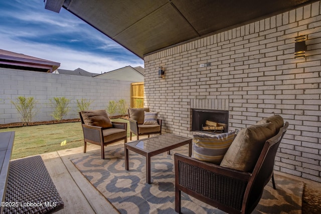 3617 127th St, Lubbock, TX 79423 - view of patio / terrace with an outdoor living space with a fireplace