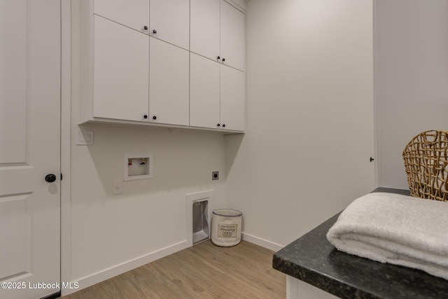 3617 127th St, Lubbock, TX 79423 - laundry room featuring cabinet space, light wood-style floors, hookup for an electric dryer, and washer hookup