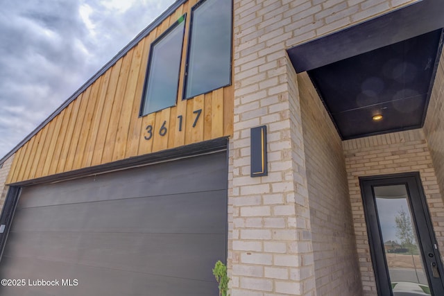 3617 127th St, Lubbock, TX 79423 - view of property exterior featuring brick siding and a garage