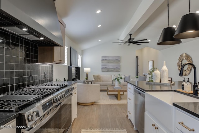 3617 127th St, Lubbock, TX 79423 - kitchen featuring stainless steel appliances, wall chimney exhaust hood, dark countertops, tasteful backsplash, and ceiling fan