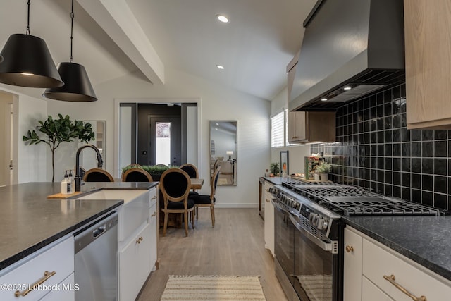 3617 127th St, Lubbock, TX 79423 - kitchen with wall chimney range hood, black range with gas stovetop, stainless steel dishwasher, backsplash, and light wood-style floors