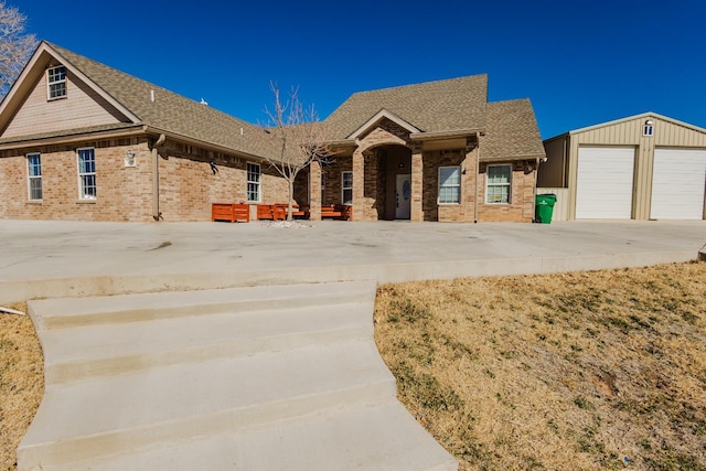 view of front facade with a garage and an outdoor structure