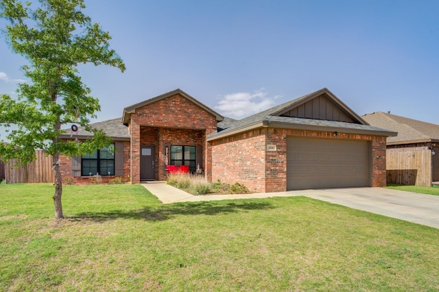 view of front of house featuring a garage and a front lawn