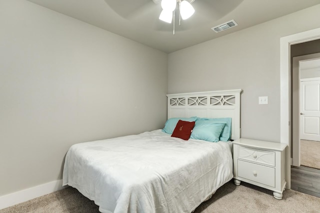 bedroom with light carpet and ceiling fan