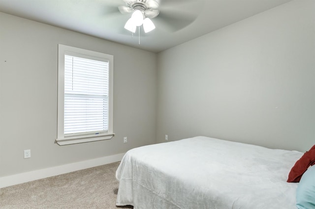 bedroom featuring ceiling fan and light colored carpet