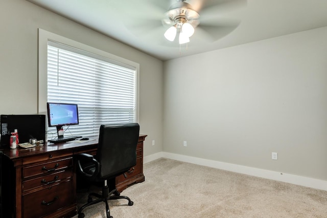 office featuring light carpet and ceiling fan