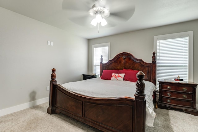 bedroom with light colored carpet and ceiling fan