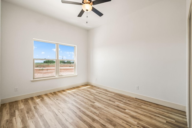 empty room featuring ceiling fan and light wood-type flooring