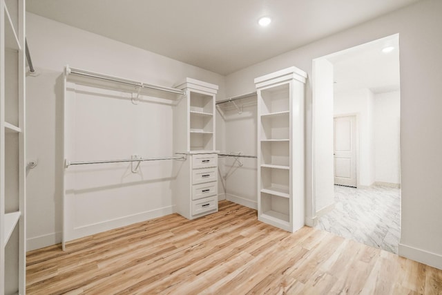 spacious closet with light wood-type flooring