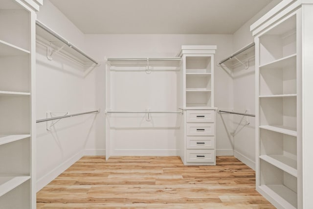 walk in closet featuring light wood-type flooring