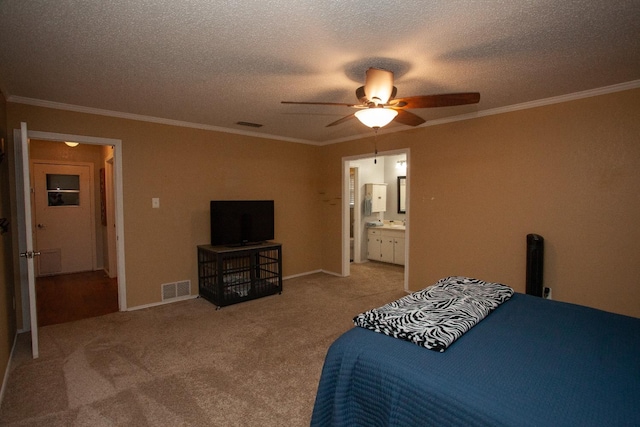 bedroom featuring crown molding, ceiling fan, connected bathroom, a textured ceiling, and light colored carpet