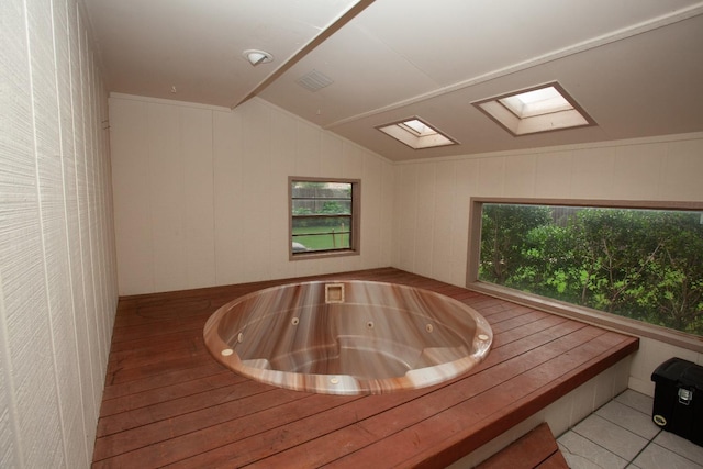 view of sauna / steam room with a skylight and tile patterned floors