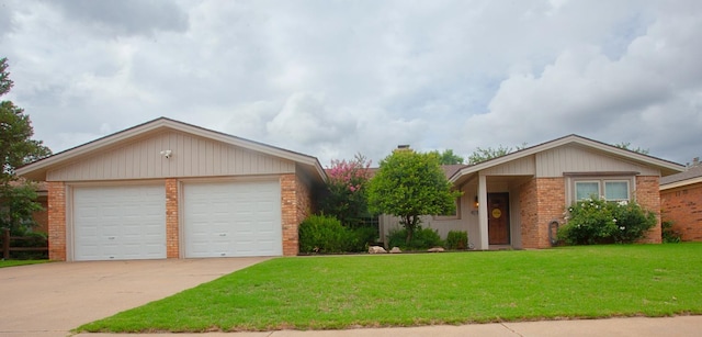 ranch-style house featuring a garage and a front yard