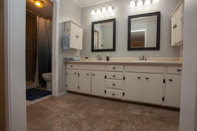 bathroom with vanity, toilet, crown molding, and a shower with shower curtain