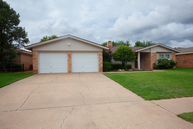 ranch-style house featuring a garage and a front lawn