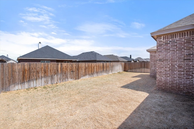 view of yard with a fenced backyard