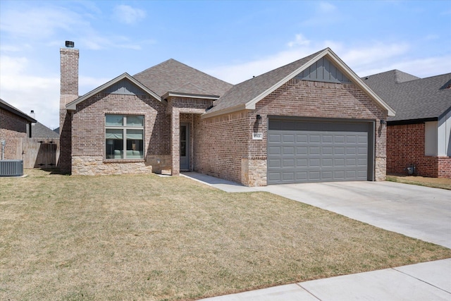 ranch-style home featuring concrete driveway, board and batten siding, brick siding, a front lawn, and a garage