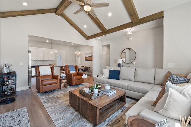 living area with light wood-style floors, beam ceiling, recessed lighting, high vaulted ceiling, and ceiling fan with notable chandelier