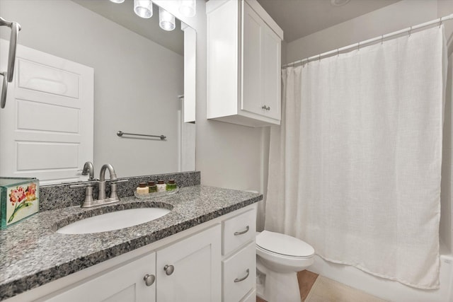 bathroom with shower / bathtub combination with curtain, toilet, and vanity