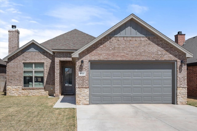 view of front of house with driveway, a chimney, an attached garage, and brick siding