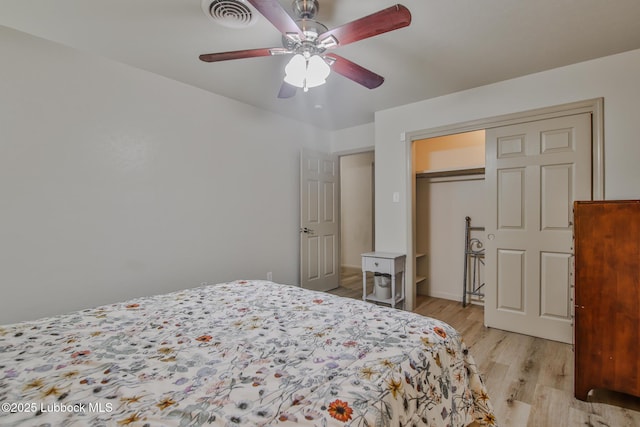 4815 15th St, Lubbock, TX 79416 - bedroom with light wood-style floors, a ceiling fan, and a closet