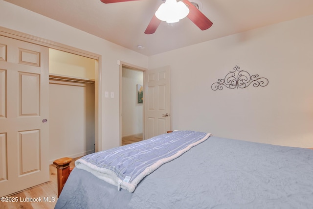 4815 15th St, Lubbock, TX 79416 - bedroom with light wood-style flooring, a ceiling fan, and a closet