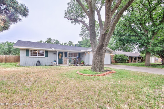 4815 15th St, Lubbock, TX 79416 - ranch-style house with brick siding, a garage, and concrete driveway
