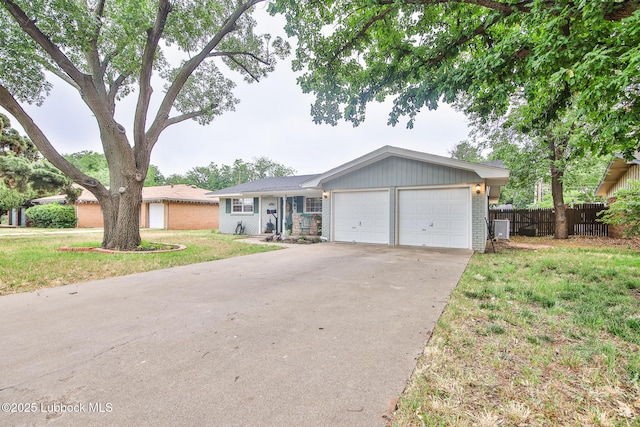 4815 15th St, Lubbock, TX 79416 - ranch-style house featuring an attached garage, driveway, and brick siding