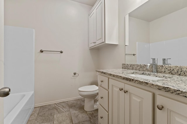 full bathroom featuring washtub / shower combination, vanity, and toilet