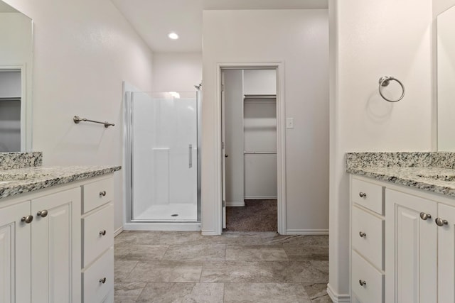 bathroom featuring vanity and walk in shower