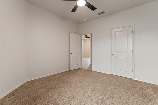 unfurnished bedroom featuring ceiling fan and carpet flooring