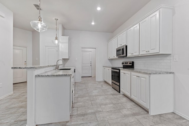 kitchen with sink, white cabinetry, stainless steel appliances, decorative backsplash, and decorative light fixtures