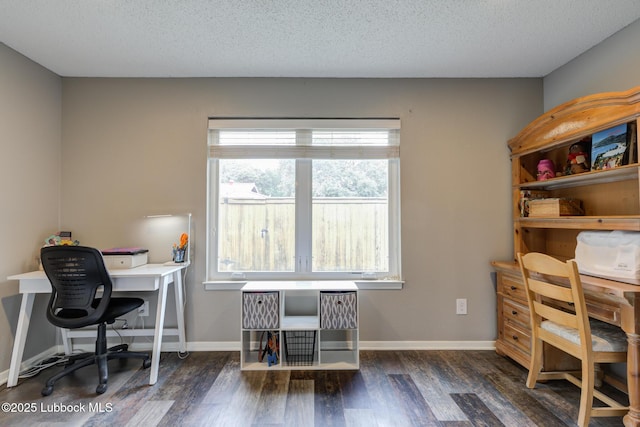 8609 Kenosha Dr, Lubbock, TX 79423 - office featuring wood finished floors, baseboards, and a textured ceiling
